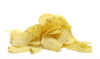 Potato chips pile with oregano spice isolated on white background