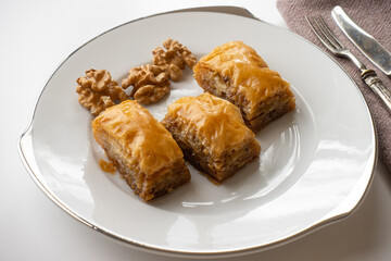 Traditional home made Baklava with walnut on white plate