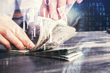Double exposure of technology drawing hologram and us dollars bills and man hands. Data concept