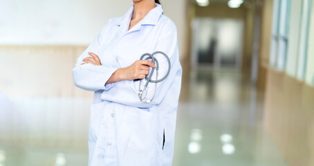 Portrait attractive confident and young female doctor  in white coat with stethoscope. Healthcare...