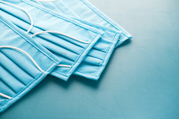 Close up of blue surgical masks on table 