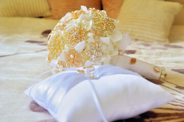 wedding bouquet on the bed