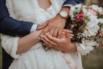 bride and groom holding hands