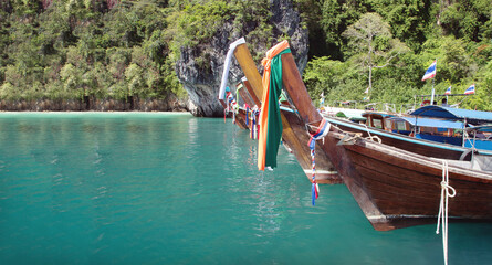 fisherman wood boat and clean sea in thailand with travel landscape