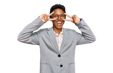 Young african american woman wearing business clothes doing peace symbol with fingers over face, smiling cheerful showing victory