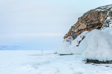 Fototapeta na wymiar Ogoy island shore in Baikal lake in winter. Irkutsk Oblast, Russia