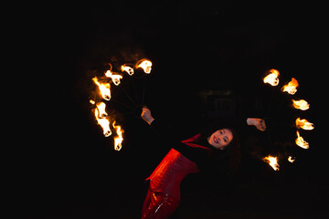 A girl shows a fire show