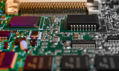 printed circuit board with surface mounted passive and active circuit components close up