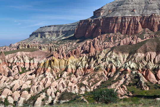 Unique geological formations in Red Valley over Aktepe Hill in Cappadocia, Turkey