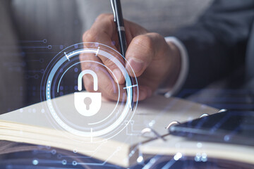 Programmer is taking notes of clients needs to protect cyber security from hacker attacks and save clients confidential data. Using smart phone. Padlock Hologram icons. Formal wear