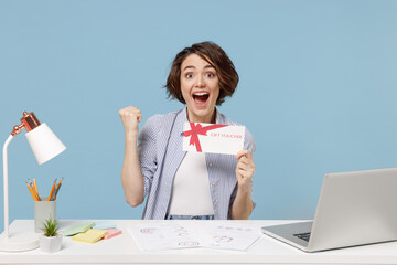 Young successful employee business woman in shirt sit work at white office desk with pc laptop hold...