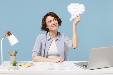 Young smiling employee business woman 20s in shirt sit work at white office desk with pc laptop...