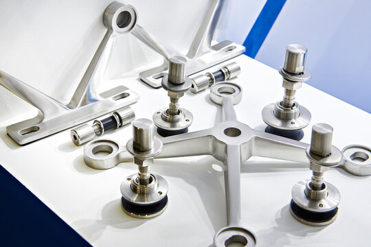Metal parts for fastening glass in store
