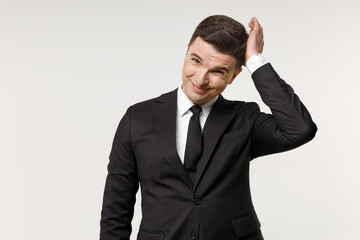 Young puzzled troubled confused employee business corporate lawyer man 20s wearing classic formal black grey suit shirt tie work in office sctratch head isolated on white background studio portrait