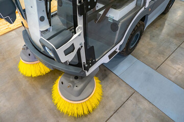 Fragment of a sweeping harvester. Concept is an electric street cleaning machine. Sweeper cab and...