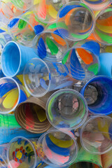 Colored plastic cups. The concept of plastic recycling and the environment. Plastic waste.
