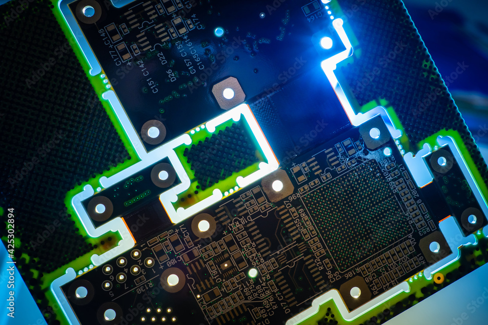 Poster circuit board close-up. dark pcb glows in dark. background consists of a piece of pcb. computer boar