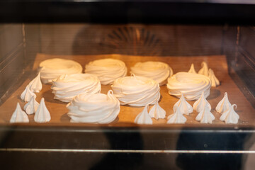 Cake Anna Pavlova. The process of making a cake Anna Pavlova. The pastry chef decorates the cake Anna Pavlova. Making a cake Anna Pavlova.