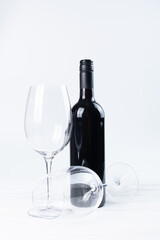 bottle and glasses of red wine