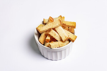 Homemade croutons in bowl isolated on white background
