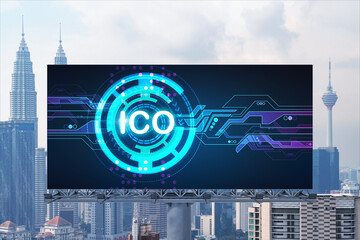 ICO hologram icon on billboard over panorama city view of Kuala Lumpur at day time. KL is the hub...
