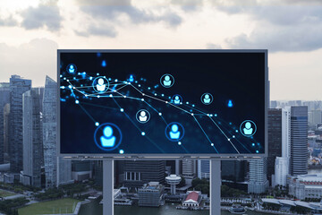 Glowing Social media icons on billboard over sunset panoramic city view of Singapore. The concept of networking and establishing new connections between people and businesses in Southeast Asia