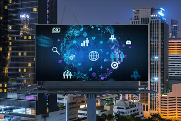 World planet Earth map hologram and social media icons on billboard over night panoramic city view of Bangkok, Southeast Asia. Networking and establishing new connections between people. Globe