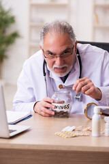 Experienced male doctor in remuneration concept