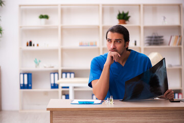 Young male doctor radiologist working in the clinic