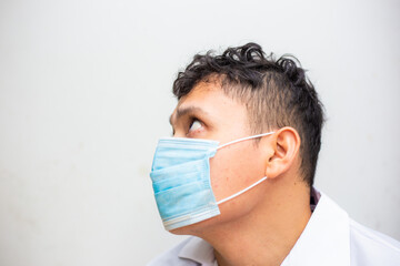 Young asian men wear surgical mask on white background