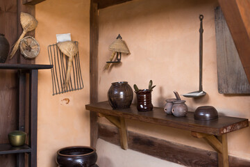 Korean Tradition kitchen - korean antique cooking utensils on a background of brown wall.