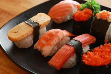 Various toppings of delicious sushi are placed on plates in Japanese restaurants. It is a very popular dish of Japan.