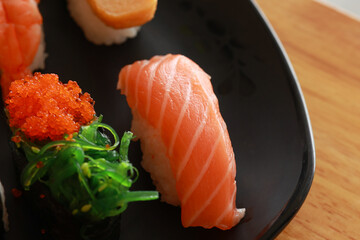 Various toppings of delicious sushi are placed on plates in Japanese restaurants. It is a very popular dish of Japan.