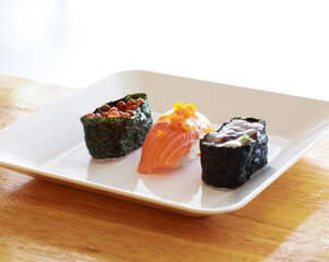 Various toppings of delicious sushi are placed on plates in Japanese restaurants. It is a very popular dish of Japan.