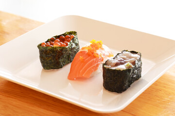 Various toppings of delicious sushi are placed on plates in Japanese restaurants. It is a very popular dish of Japan.