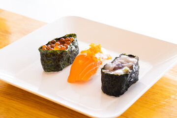 Various toppings of delicious sushi are placed on plates in Japanese restaurants. It is a very popular dish of Japan.