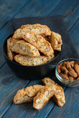 Cantuccini biscotti with almonds on a rustic background.