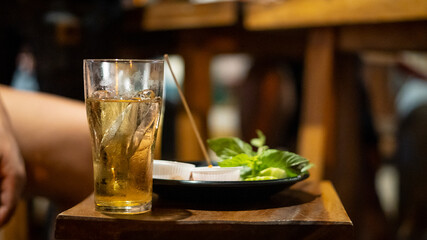 Beer glasses placed on tables in liquor and food stores.