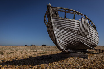 Fototapeta na wymiar Fishing boat wreck at Dungeness, Kent, England