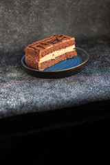 gluten free cake piece sugar-free and lactose free chocolate cream layers trend meal copy space food background rustic. top view