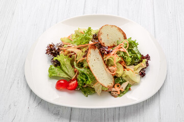 Fresh vegetables salad with croutons and chicken