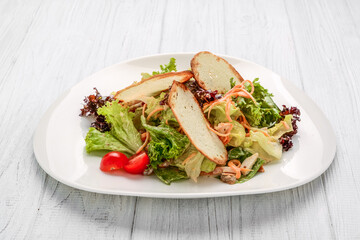 Fresh vegetables salad with croutons and chicken