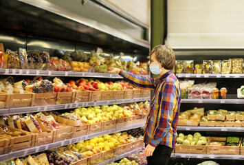 Supermarket shopping, face mask and gloves,man buying vegetables at the market