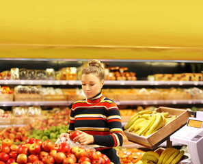 Woman buying fruits at the market