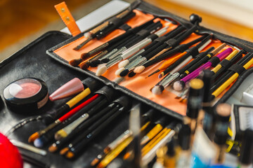 Set of arranged professional cosmetic brushes. Creative mess