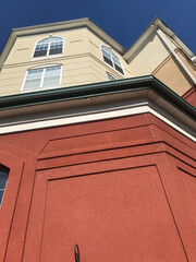 red/tan brick building with windows