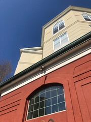 red/tan brick building with windows