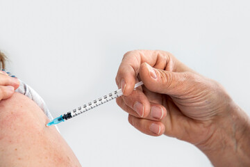 vaccination syringe in the arm