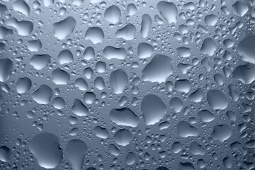 water droplets on glass in blue