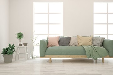 Fototapeta premium White living room with soft green sofa. Scandinavian interior design. 3D illustration